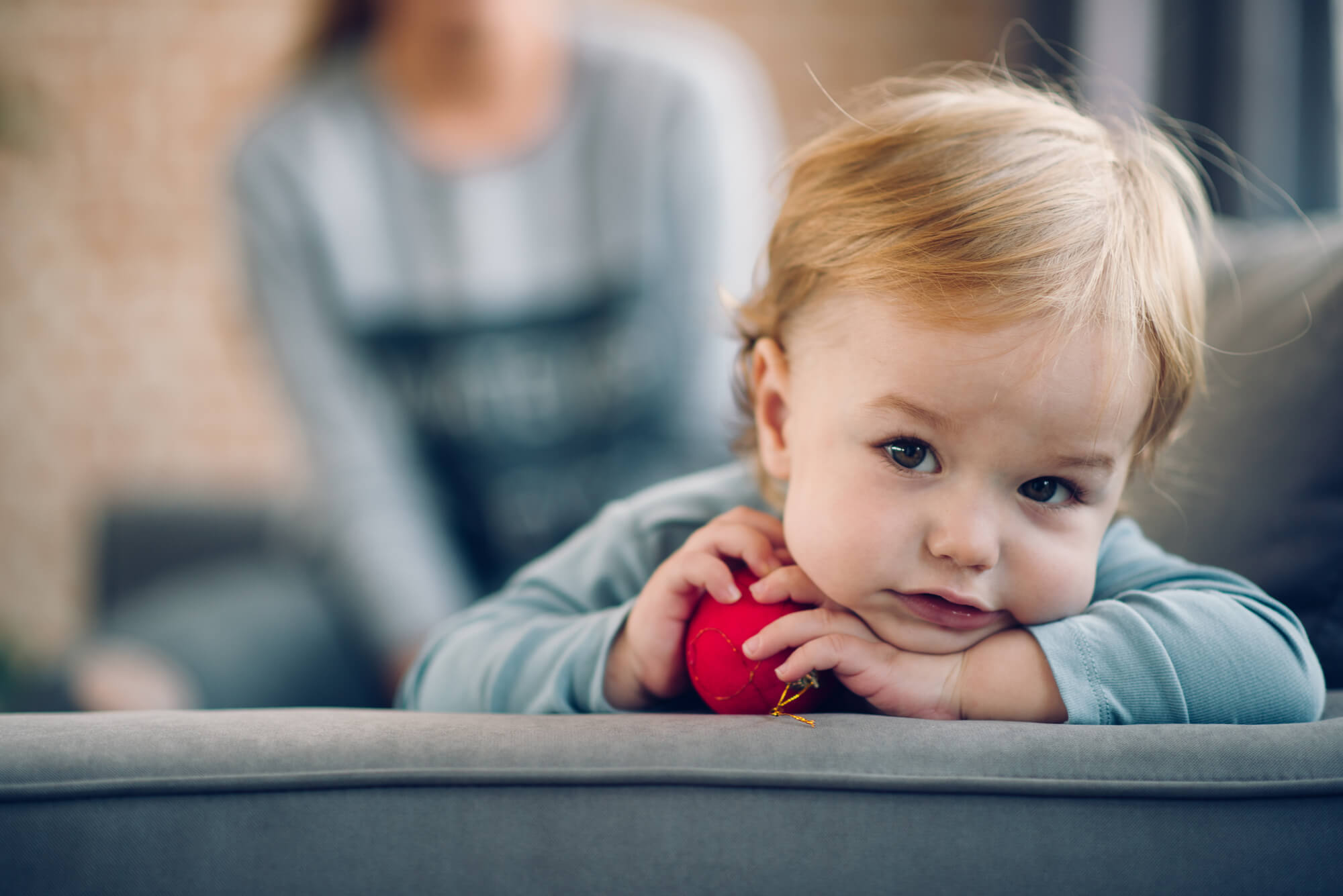 toddler holding a ball