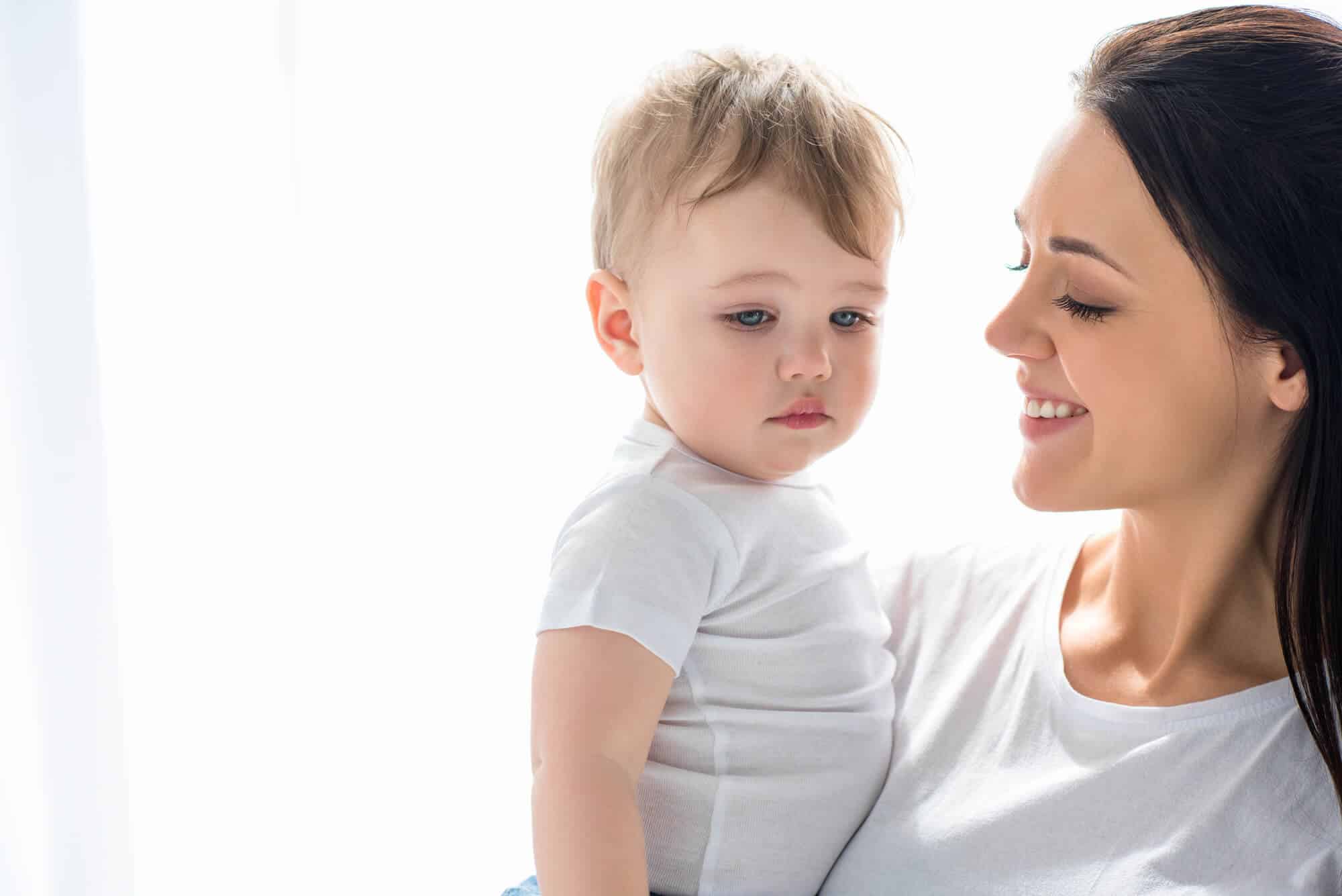 mom holding toddler